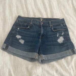 Mid rise distressed jean shorts by 7 for all mankind. Size 28.